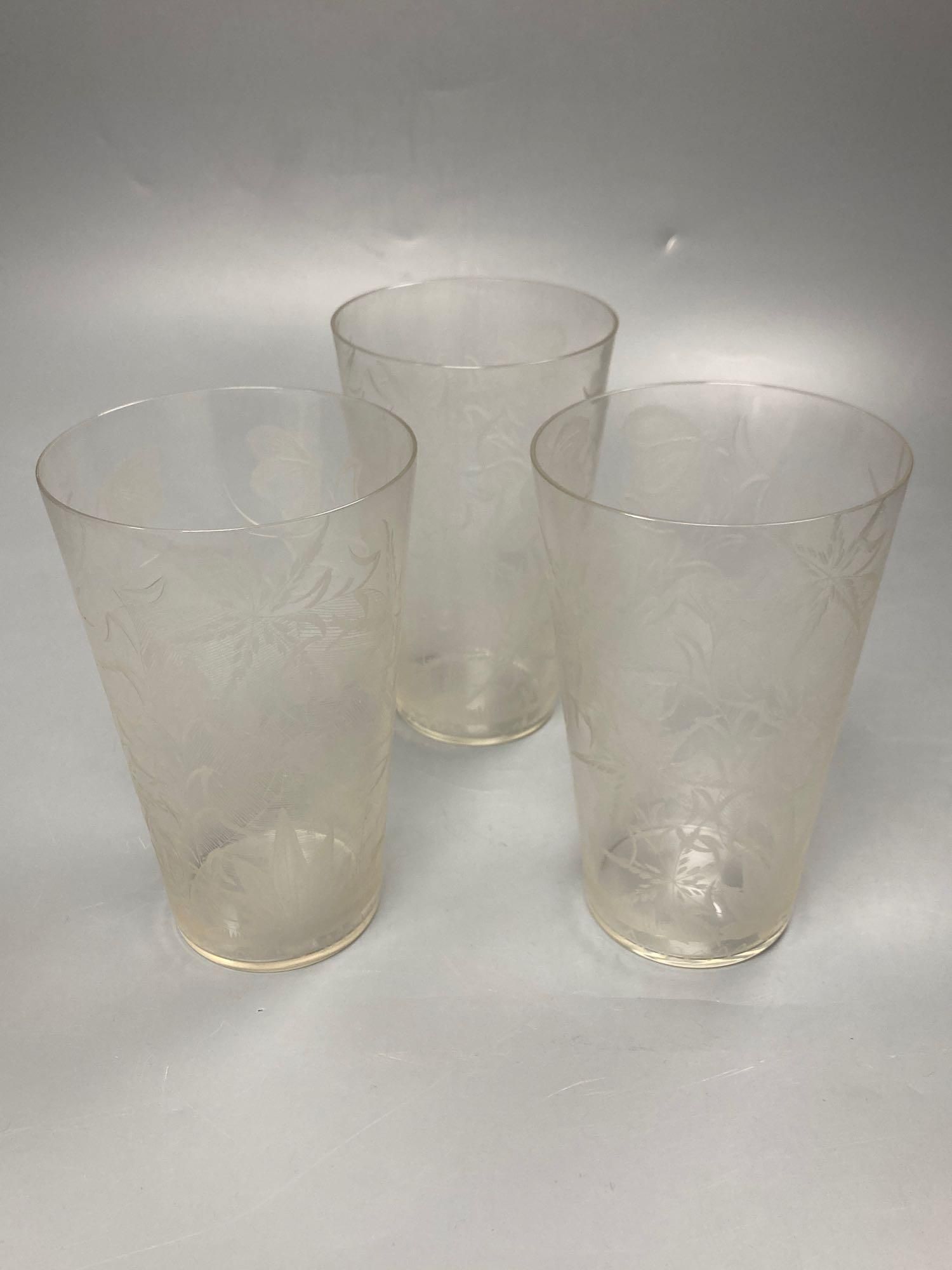 Three Stourbridge beaker shaped glasses, each engraved with a spider in a web, 14.5cm high
